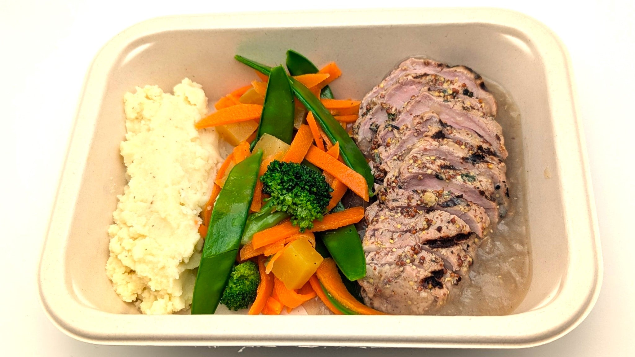 Filet de porc mariné à la moutrade et aux herbes